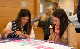 students collaborating at a table